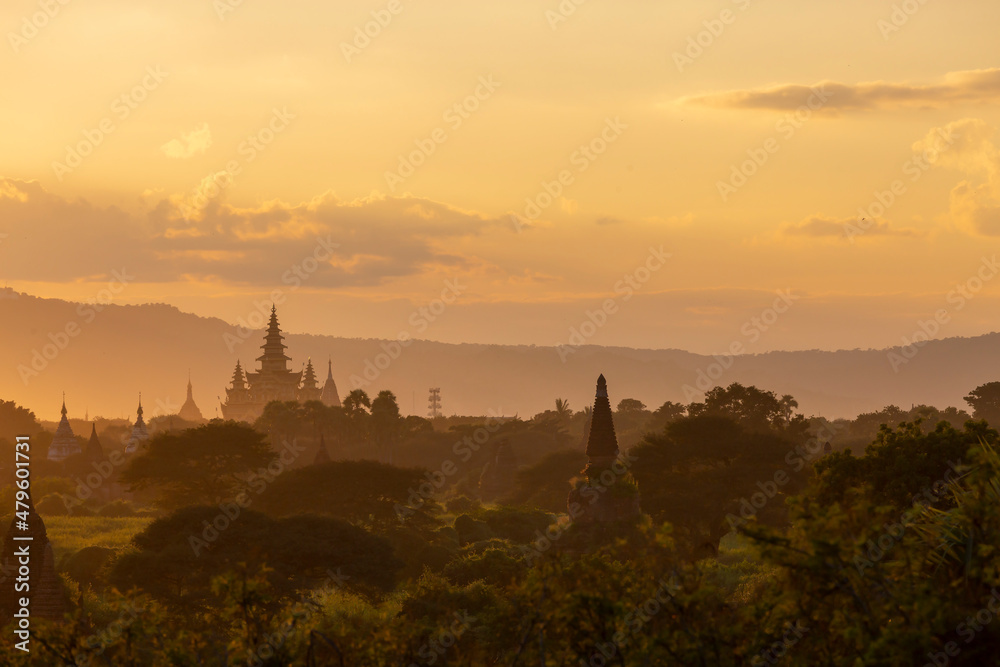 group of ancient pagodas in Bagan at the sunset, myanmar