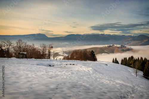 Snowy mountain landscape at sunset 