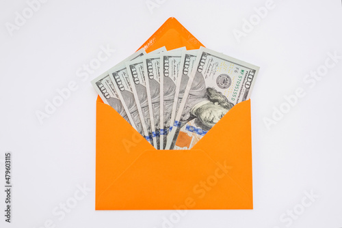 dollars in an orange envelope on a white background.