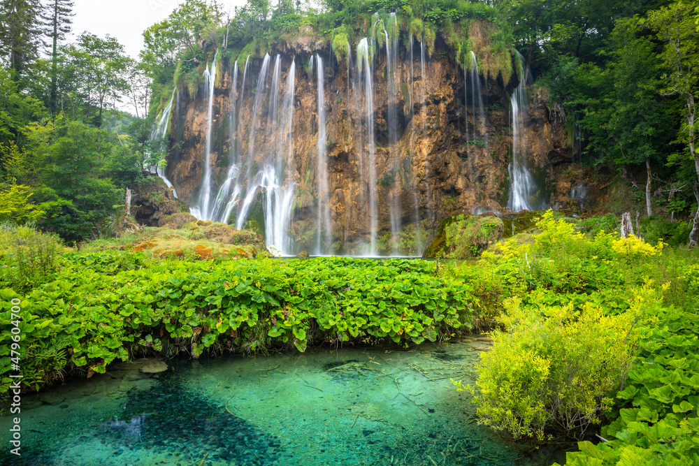 Large panorama of waterfalls in Plitvice Lakes National Park, Croatia, Europe. Majestic view with turquoise water of the lake and waterfalls, tourist attractions