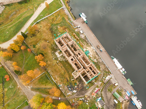 Solovki. Monastery pier. The destroyed Preobrazhenskaya hotel. Russia, Solovetsky Islands  photo