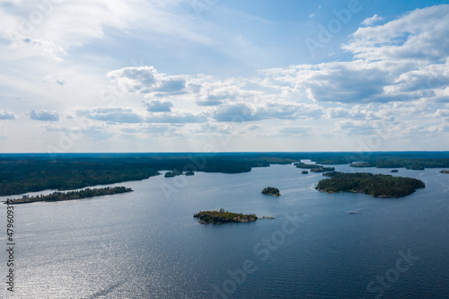 Aerial photography on Ladoga skerries. Ladoga Lake in Karelia in hot summer. Rocky wild islands in the middle of the lake. Russian nature © AndreyZayats