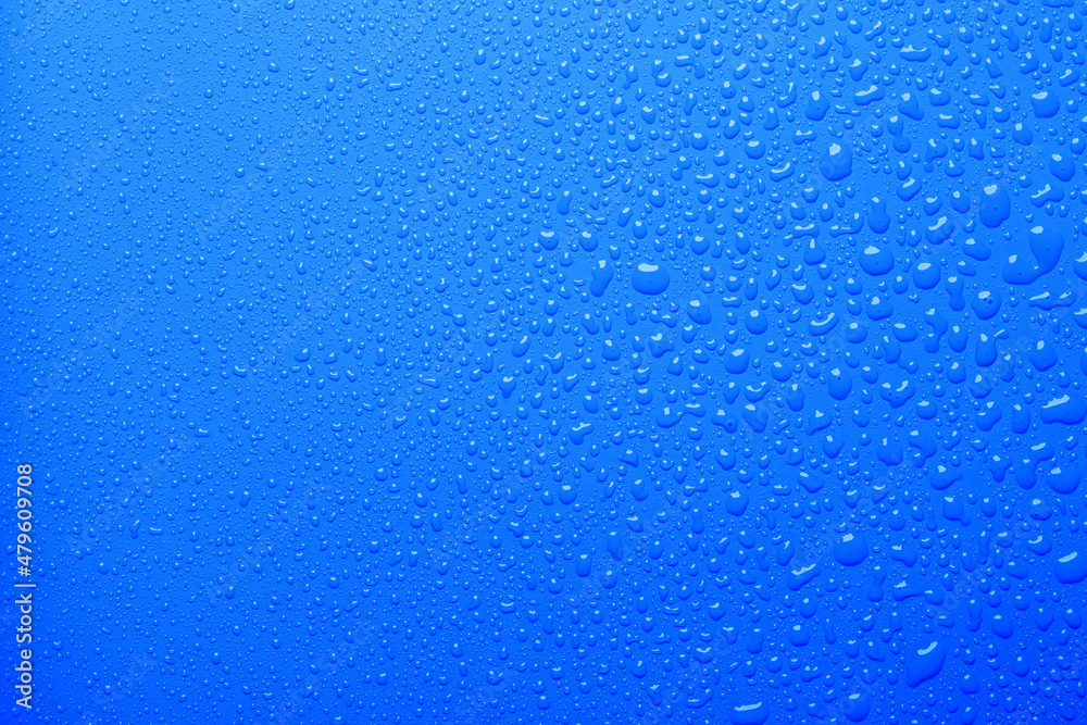 Water drops on blue color surface Water drops on blue color surface