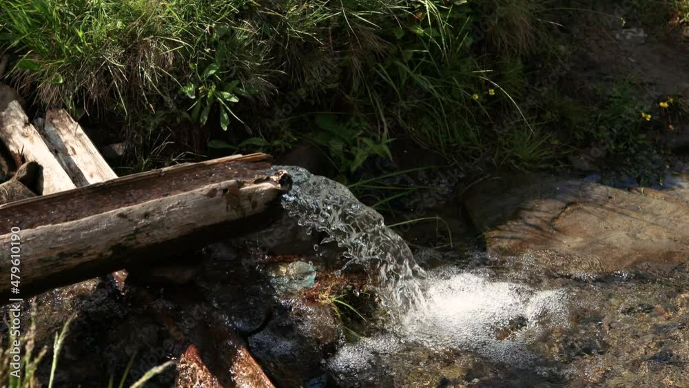 Fresh clear and cold mountain water from stream at autumn forest Fresh clear and cold mountain water from stream at autumn forest