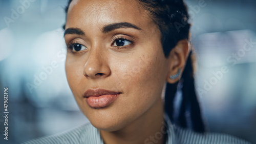 Portrait of Gorgeous Black Woman with Deep Brown Eyes, Braided Hair, Perfect Smile. Beautiful Girl Turn. Bokeh out of Focus Background. Close-up