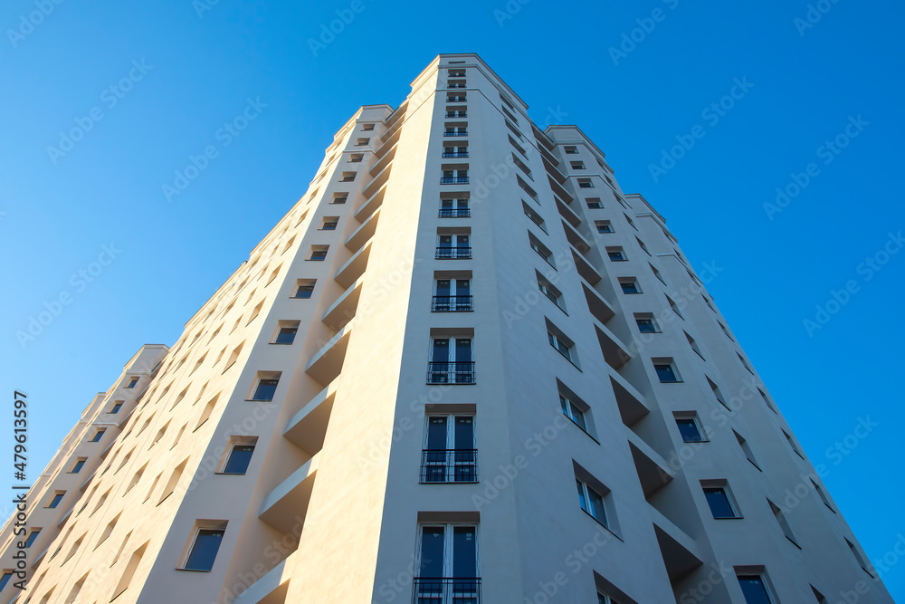 Facade of a new multi-story residential building. architecture and modern construction Facade of a new multi-story residential building. architecture and modern construction