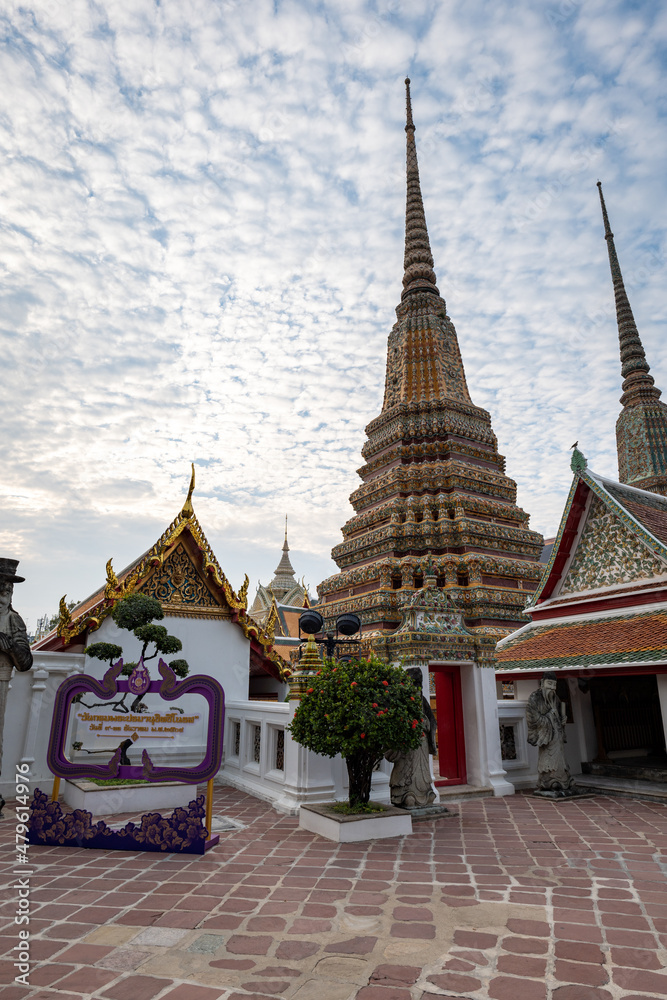 Fototapeta premium Wat Pho, also spelled Wat Po, a famous Buddhist temple complex in Bangkok, Thailand. Popular for tourists and it is also known as Temple of the Reclining Buddha. 