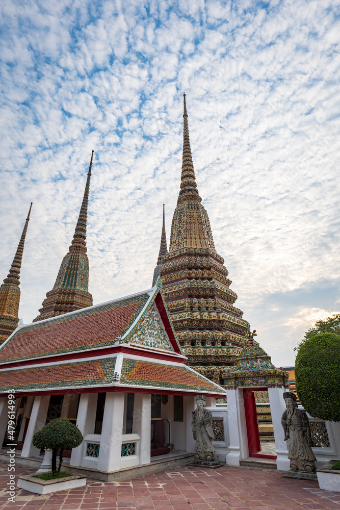 Fototapeta premium Wat Pho, also spelled Wat Po, a famous Buddhist temple complex in Bangkok, Thailand. Popular for tourists and it is also known as Temple of the Reclining Buddha. 