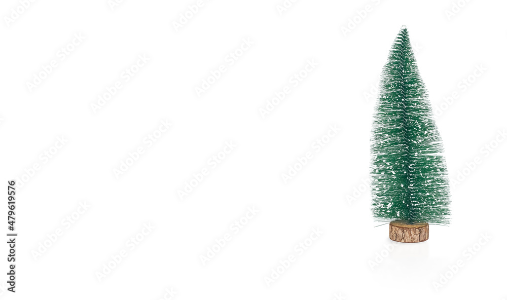 Christmas fir tree toy on white background. New Year banner with copy space for text. Christmas fir tree toy on white background. New Year banner with copy space for text.