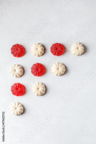 Fruit marmalade on white background. Slices of marmalade sprinkled with granulated sugar