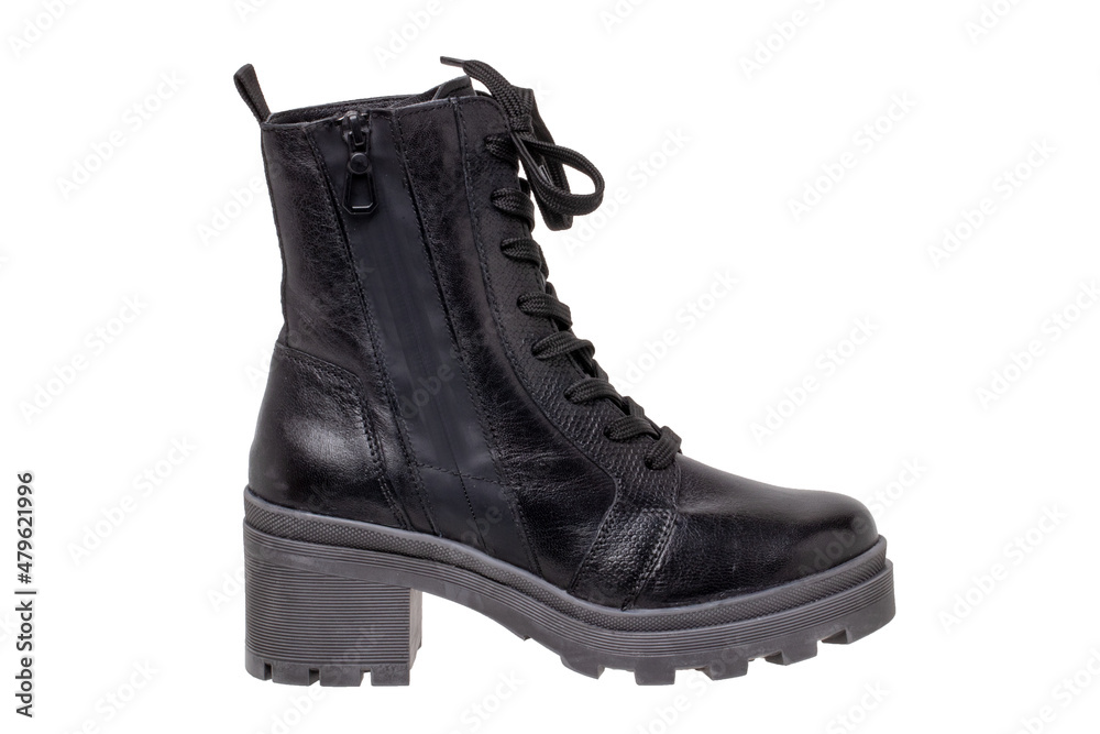 Womens boots and shoes. Closeup of a single elegant black leather winter boots. Latest trends of winter shoe fashion for girls isolated on white background. Macro. Womens boots and shoes. Closeup of a single elegant black leather winter boots. Latest trends of winter shoe fashion for girls isolated on white background. Macro.