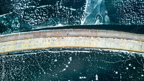 Aerial view of a pier on a frozen lake