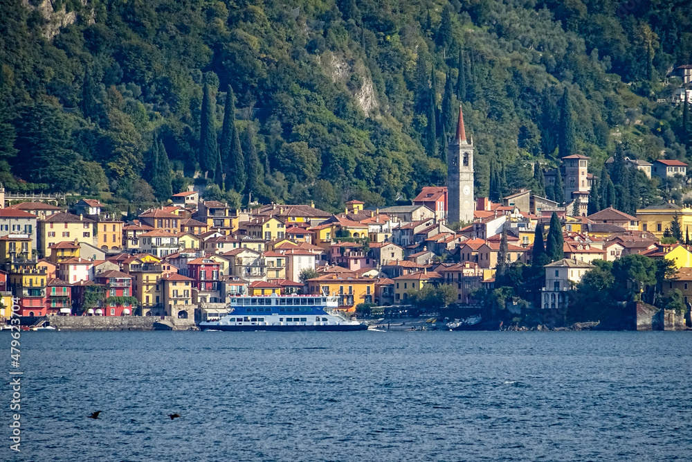 Citty of Varenna, lake como, italy, view from lake with ferry in foreground crossing