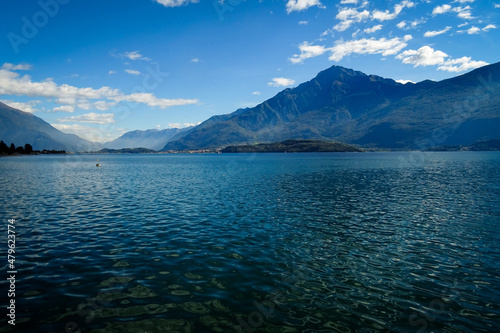 panorama of lake como with monte Legnone in background, blue water an beautiful bluee sky