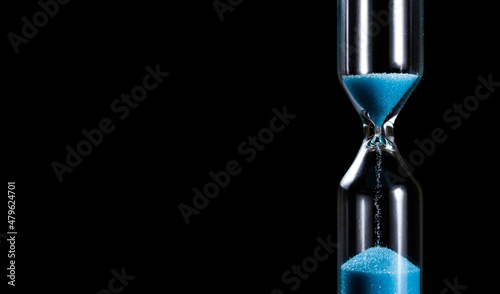 Hourglass on black background