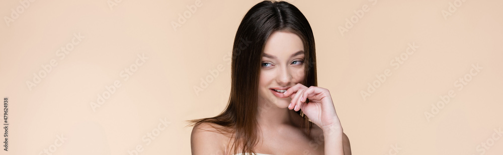 pretty young woman with bare shoulders smiling isolated on beige, banner pretty young woman with bare shoulders smiling isolated on beige, banner