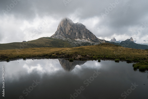 Dramatic mirror image in the water of the peak Ra Gusela in Passo di Giau. Dolomiti Alps, Cortina d'Ampezzo location, South Tyrol, Italy, Europe.