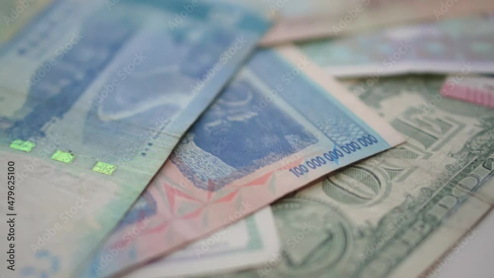 Collection of world money currencies scattered in the background