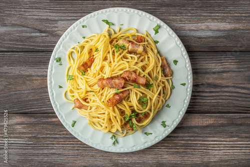 Classic homemade pasta carbonara with spaghetti, pancetta, egg, parmesan cheese and cream sauce