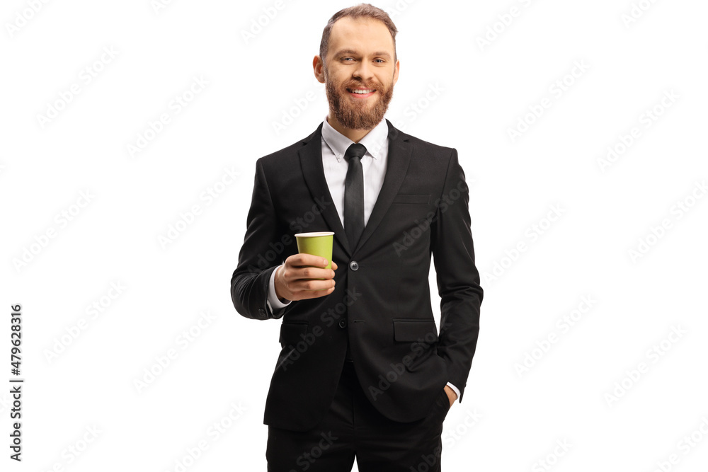 Smiling businessman holding a takeaway coffee cup Smiling businessman holding a takeaway coffee cup