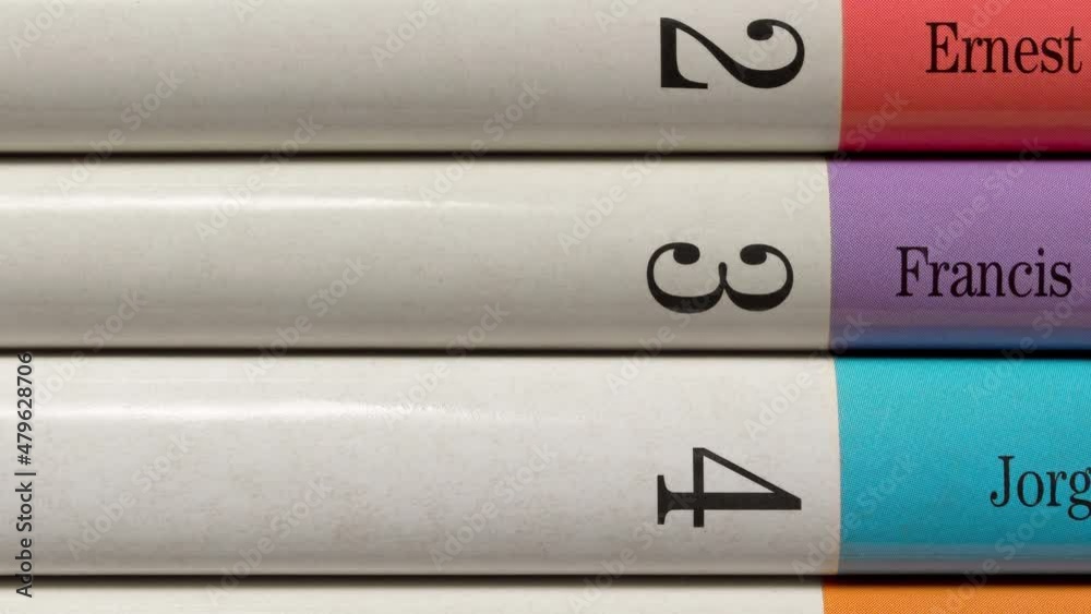 Panning on a few stacked colored books