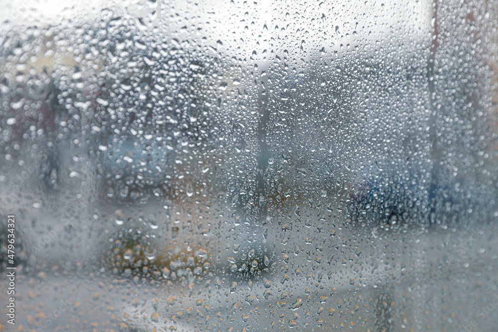 Closeup view of foggy window with rain drops Closeup view of foggy window with rain drops