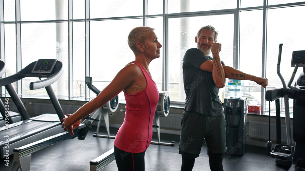 Fototapeta premium Concentration and determination while exercising in gym