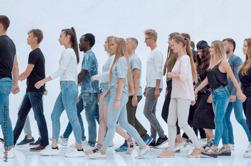 Obraz premium group of young people striding towards their goal.