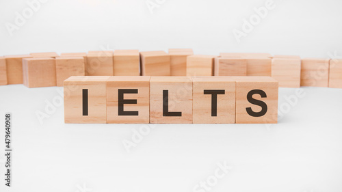 IELTS word, text, written on wooden cubes, building blocks, over white background