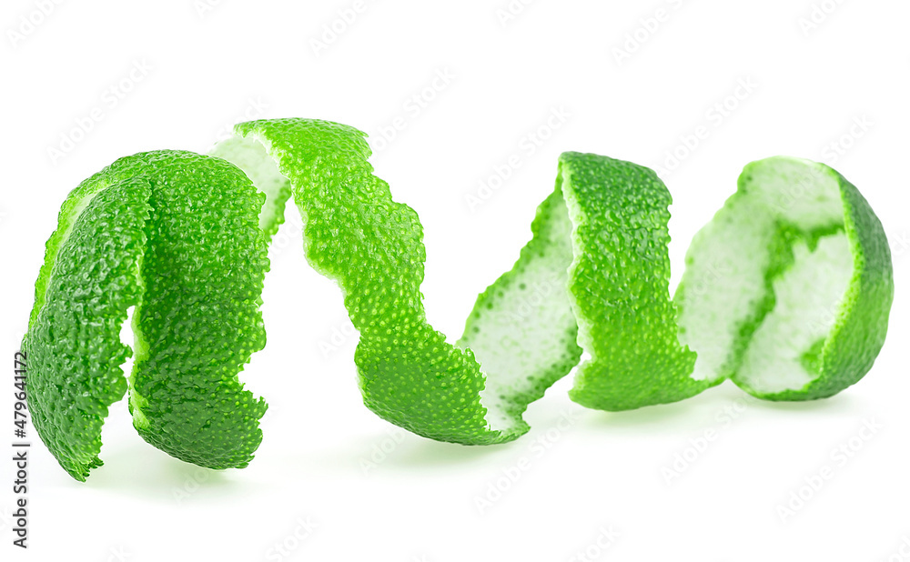 Fresh lime fruit zest isolated on a white background. Curly lime peel twist. Healthy food. Fresh lime fruit zest isolated on a white background. Curly lime peel twist. Healthy food.