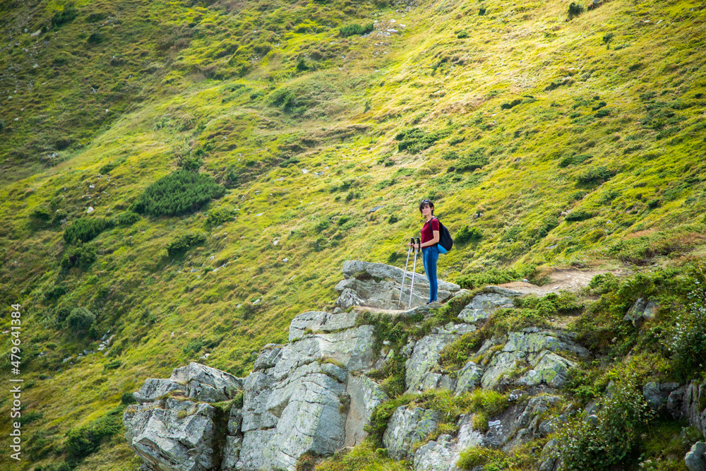 Girl Descend Down a Large Green Mountain Range