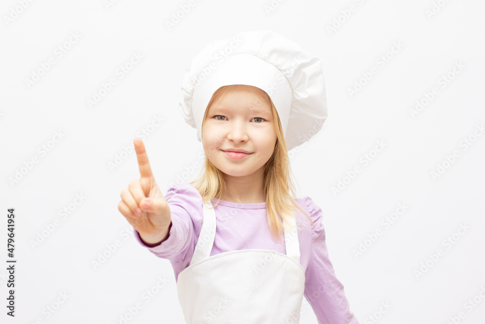 Beautiful little girl in chef uniform isolated on white Beautiful little girl in chef uniform isolated on white