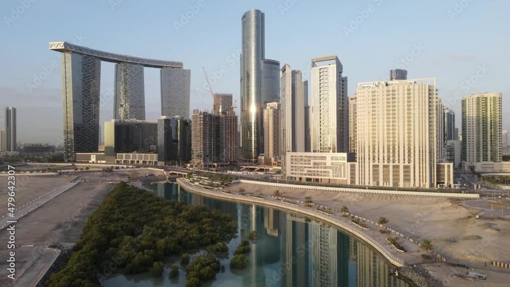 Aerial view on developing part of Al Reem island in Abu Dhabi on a cloudy morning. Drone footage. Aerial view on developing part of Al Reem island in Abu Dhabi on a cloudy morning. Drone footage.