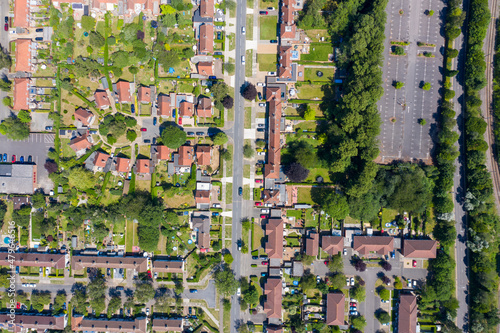 Top down aerial footage of the suburban houses and village of Welwyn Garden City in Hertfordshire taken on a hot sunny summers day showing a straight down view of the typical British housing estates photo