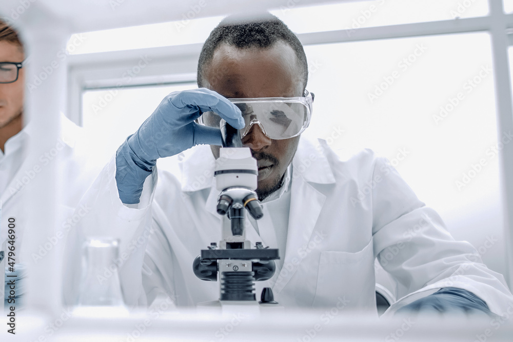 group of scientists working with liquids in the laboratory group of scientists working with liquids in the laboratory