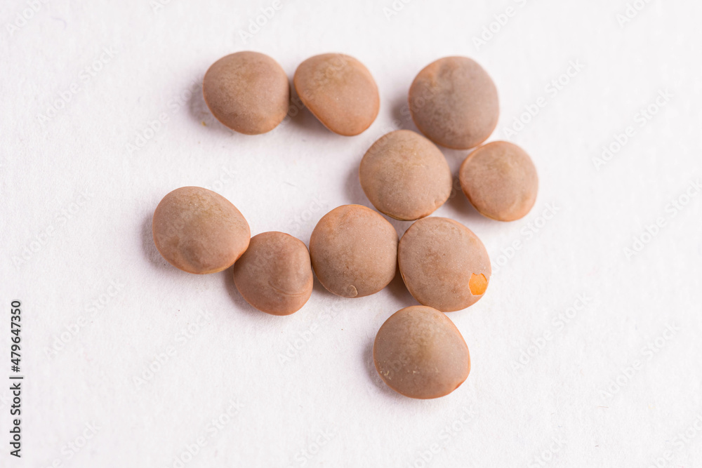 Lentils raw uncooked on white background Lentils raw uncooked on white background