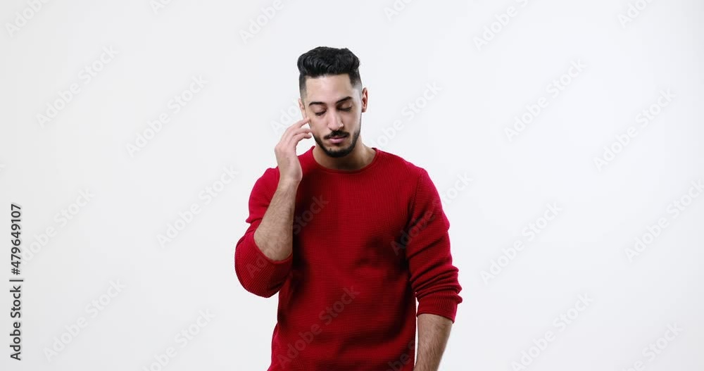 Young man suffering from severe headache over white background Young man suffering from severe headache over white background