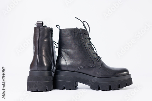 Women's black leather boots on a white background. Shoes and options for its layout. Autumn shoes. Boots. Autumn boots. Shoes close up © Дмитрий Ткачук