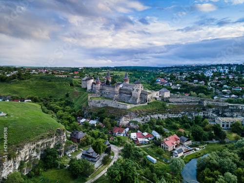 Aerial view of Kamianets-Podilskyi castle in Ukraine. The fortress located among the picturesque nature in the historic city of Kamianets-Podilskyi, Ukraine. 