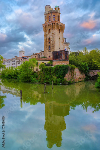Torlonga tower reflected in water. Historical Carrara Castle in Padua, Veneto, Italy