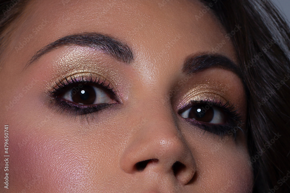Elegance close-up female eye with light pink eyeshadow. Macro shot of part of the face of a beautiful woman. Wellness, cosmetics and makeup. smooth beautiful eyebrows and eyelashes Elegance close-up female eye with light pink eyeshadow. Macro shot of part of the face of a beautiful woman. Wellness, cosmetics and makeup. smooth beautiful eyebrows and eyelashes