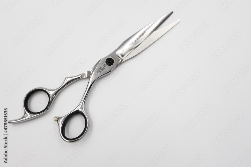 professional scissors open on a white background professional scissors open on a white background