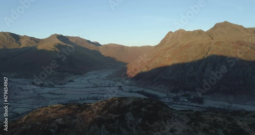 Sunrise over mountains and valley photo