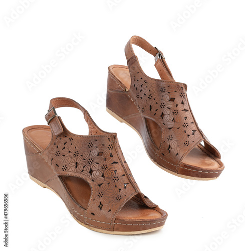 Pair of women's brown leather shoes flying