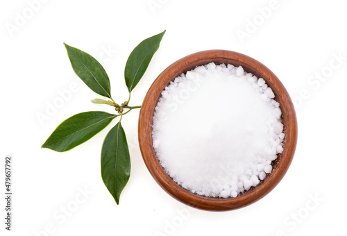 Camphor or Cinnamomum camphora crystal and green leaves isolated on white background with clipping path.top view,flat lay photo
