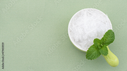 Kitchen mint and menthol isolated on green background. photo