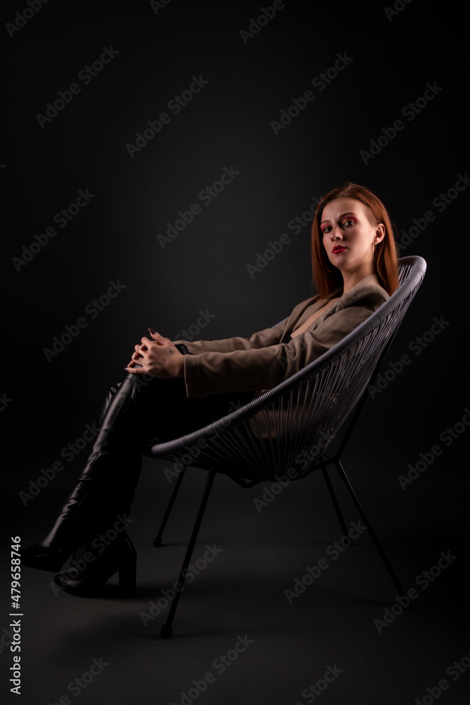 Portrait of pretty woman with red hair,