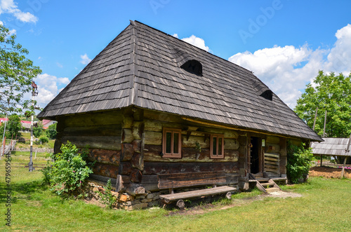 Rural landscape of ancient old wooden houses in the traditional style in the mountain village Kolochava, Transcarpathia, Ukraine