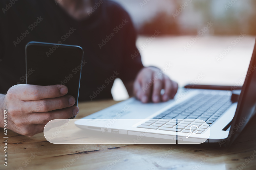 Fototapeta premium Search technology, search engine optimization,man's hand using laptop computer keyboard to search information,using search engine bar function on your website.People who work in cafes