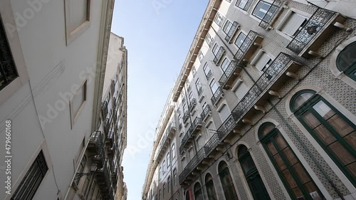 Ultra wide lens pan over tall luxury Lisbon apartment buildings in residential upscale neighborhood - investiment in real estate market photo